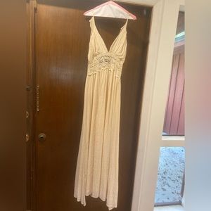 Off white/cream floor length dress.  Spaghetti strap. Low cut back